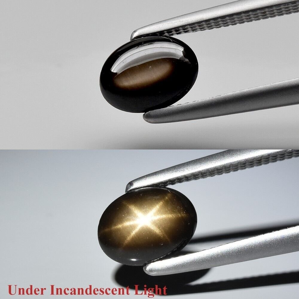 Черный звездный сапфир кабошон  0,91 карата овал 6,5х4,8 мм